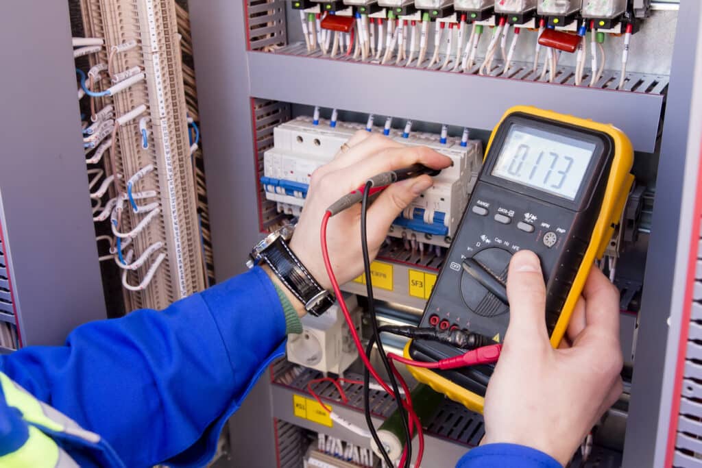 electrician measures voltage