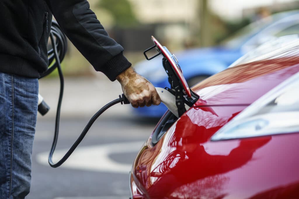 Electric car plugged into charger